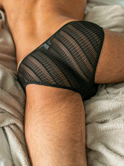 Side worn view of Sheer Black Mesh Low Rise Bikini Brief